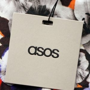 Closeup of an Asos clothing tag.