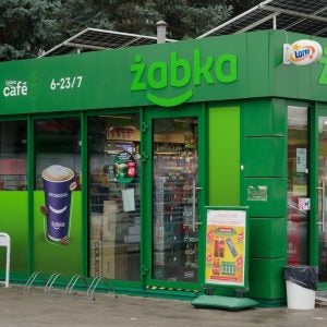 Daytime view of Żabka convenience store.